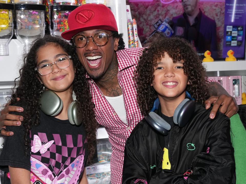 Moroccan Cannon, Nick Cannon and Monroe Cannon attend the Natti Natasha & Nick Cannon host Sugar Factory in Times Square on August 11, 2023 in New York City.