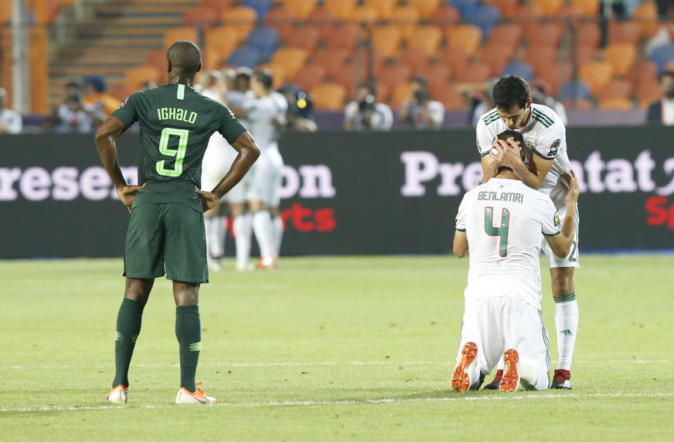 Algerian players celebrate after a goal during the African Cup of Nations semifinal soccer match between Algeria and Nigeria in Cairo International stadium in Cairo, Egypt, Sunday, July 14, 2019. (AP Photo/Ariel Schalit)