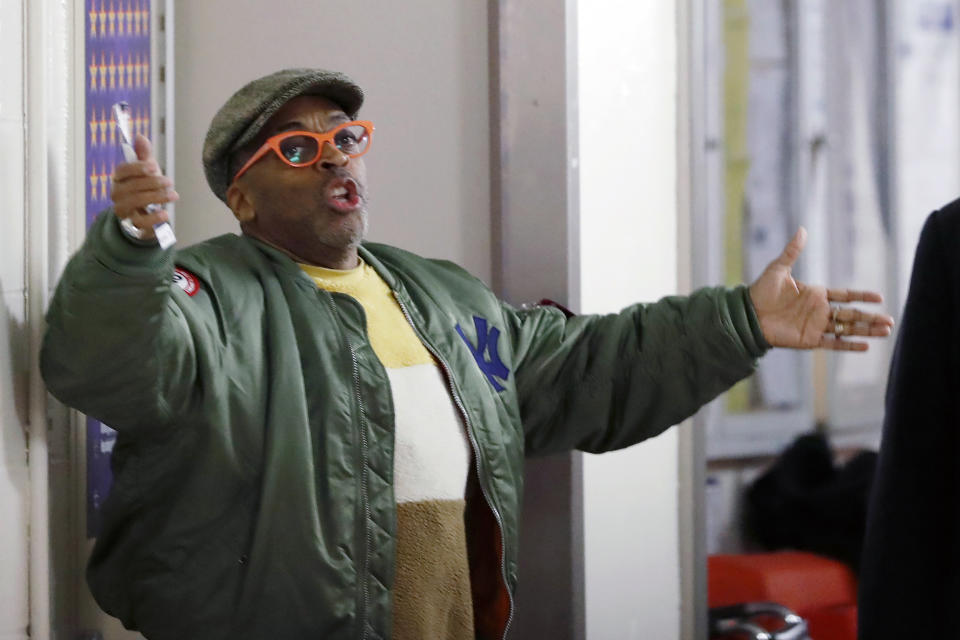 FILE - In this March 2, 2020, file photo, director Spike Lee, left, gestures while arguing with security officers in a hallway on the event level at Madison Square Garden in New York. Bubba Wallace now counts Spike Lee and Demi Lovato – his admitted celebrity crush – as those loudly in his corner since he’s become the leader of NASCAR’s push for change. (AP Photo/Kathy Willens, File)