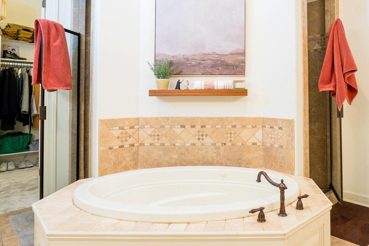 The primary bathroom is large enough to feature a large soaker tub.