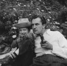 <p>The horror actor, star of <em>House of Wax</em> and <em>House on Haunted Hill</em>, relaxes with his son in the yard of his Beverly Hills home, circa 1946.</p>