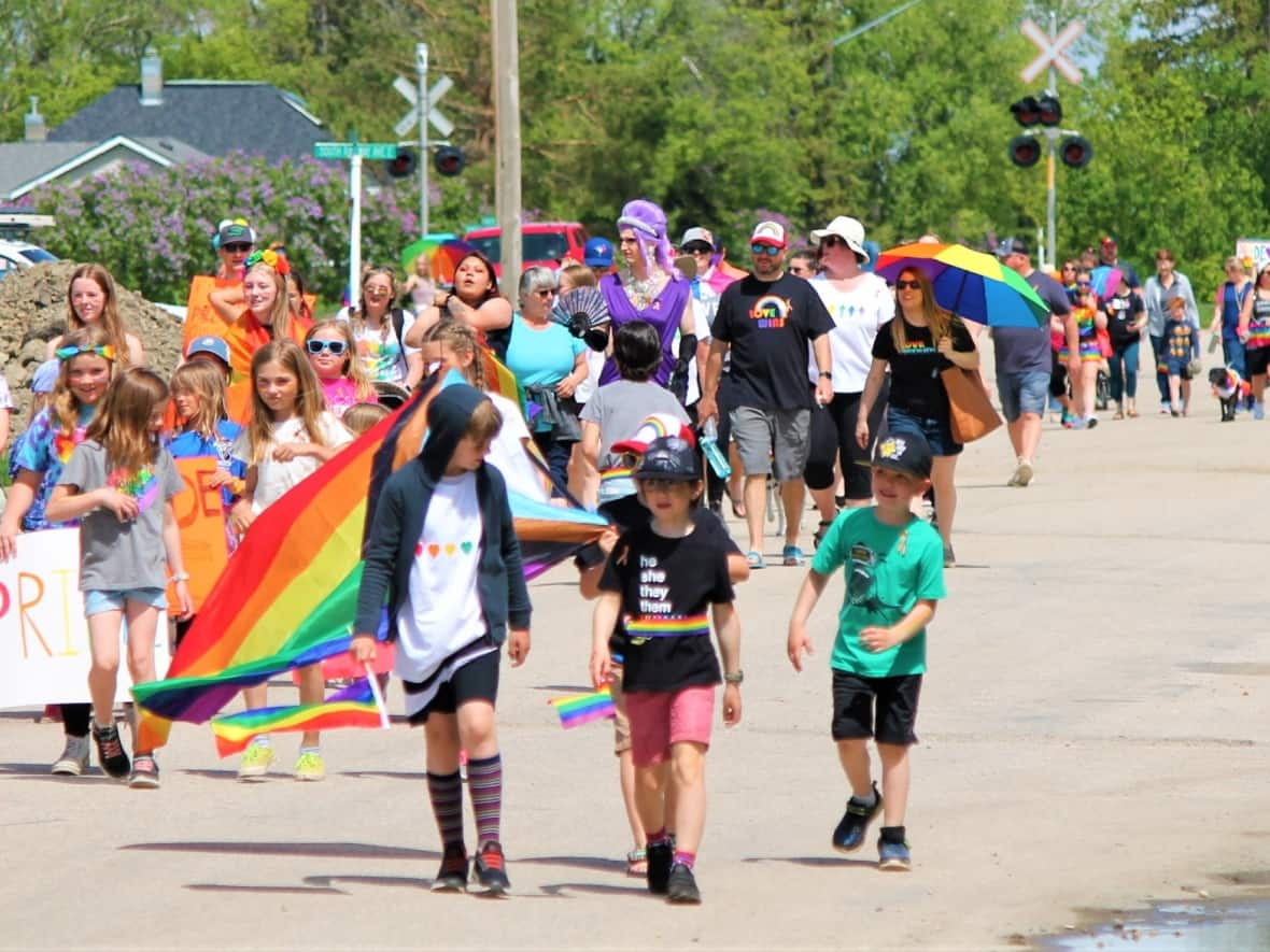 People walking in the Foam Lake Pride parade on June 11, 2022. The community hosted its first Pride parade in 2021. (Nelson Bryksa - image credit)