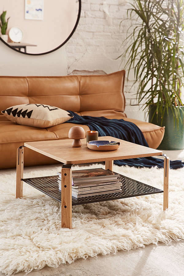 <a href="https://www.urbanoutfitters.com/shop/jamison-coffee-table?category=apartment-new-arrivals&amp;color=020" target="_blank">The storage underneath</a> will help declutter the top of your coffee table giving the illusion that you have a lot more space.