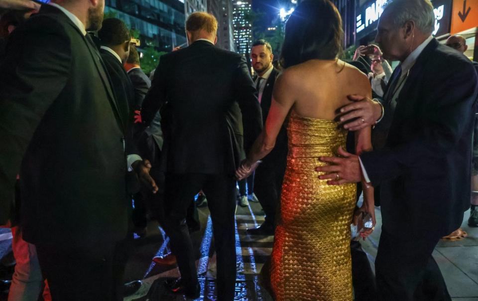 Harry and Meghan leaving the ceremony on Tuesday night - Anadolu