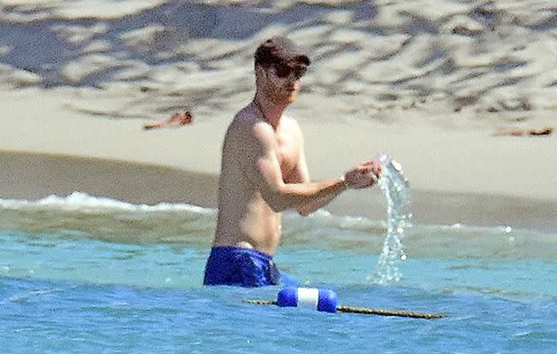 Prince Harry seemed to be enjoying his Jamaican holiday after watching one of his oldest friends get married. Photo: MEGA