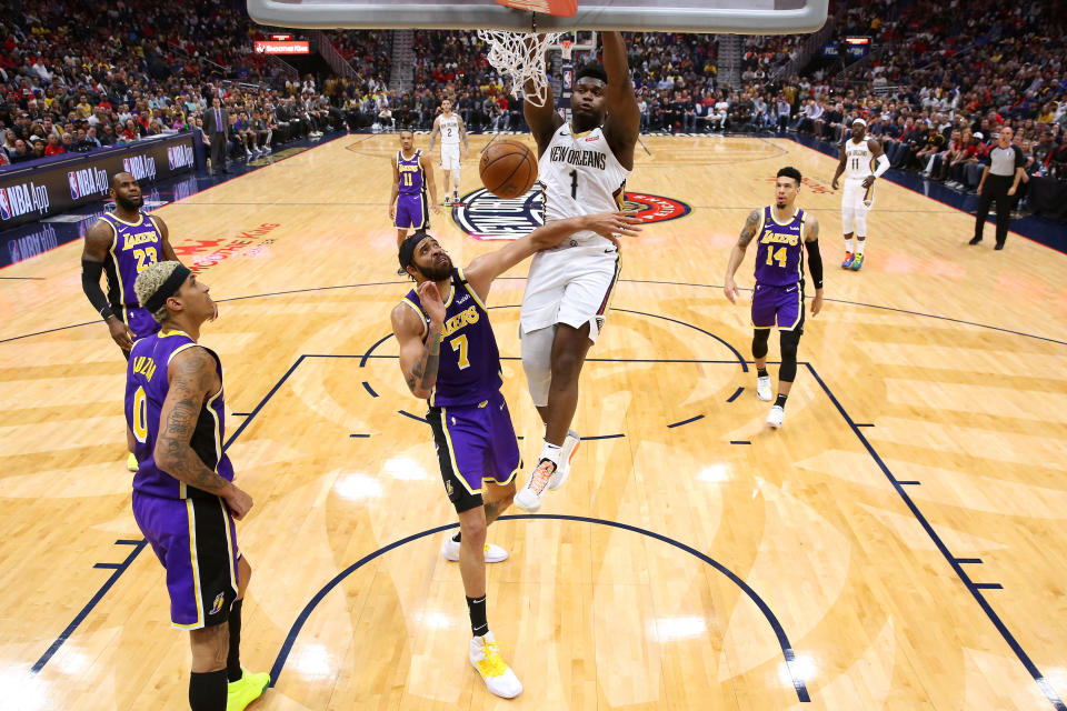 NEW ORLEANS, LOUISIANA - MARCH 01: Zion Williamson #1 of the New Orleans Pelicans dunks the ball over JaVale McGee #7 of the Los Angeles Lakers during the second half at the Smoothie King Center on March 01, 2020 in New Orleans, Louisiana. NOTE TO USER: User expressly acknowledges and agrees that, by downloading and or using this Photograph, user is consenting to the terms and conditions of the Getty Images License Agreement. (Photo by Jonathan Bachman/Getty Images)