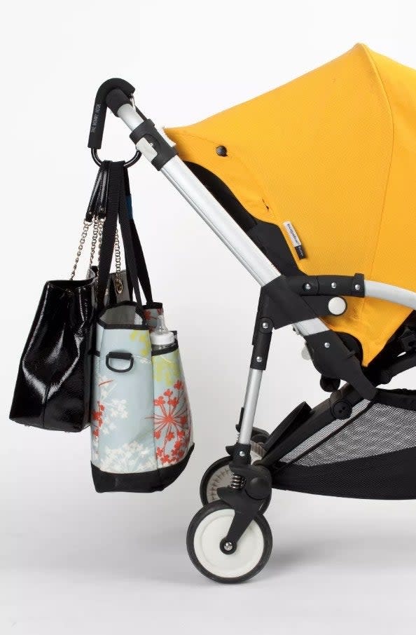 Mommy hook clipped to stroller holding bags