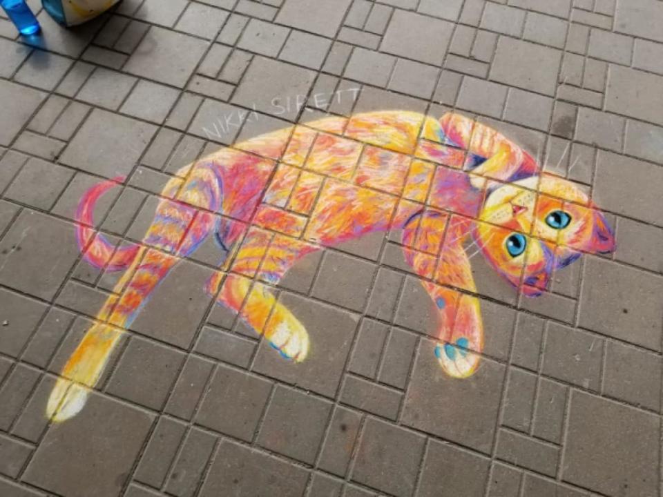 Artist Nikki Sirett says her chalk drawings have helped her stay connected with beloved animals near and far — like this drawing of her own cat, Lola, who is currently living with her parents. (Nikki Sirett - image credit)