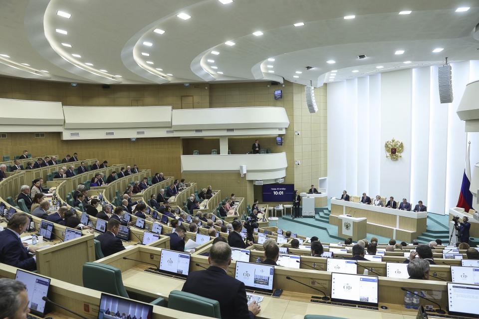 In this photo provided by The Federation Council of The Federal Assembly of The Russian Federation Press Service, lawmakers of Federation Council of the Federal Assembly of the Russian Federation attend a session in Moscow, Russia, Wednesday, Oct. 25, 2023. The upper house of the Russian parliament has revoked the ratification of a global nuclear test ban in what Moscow has described as a move to put itself on par with the United States. (Federation Council of the Federal Assembly of the Russian Federation via AP)