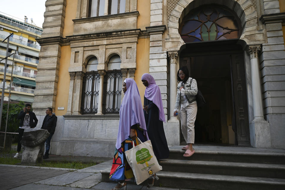 People leave after the morning prayers from the historic Yeni Cami, or New Mosque, in the port city of Thessaloniki, northern Greece, Wednesday, April 10, 2024. Eid prayers held in the historic former mosque in northern Greece for the first time in 100 years. (AP Photo/Giannis Papanikos)