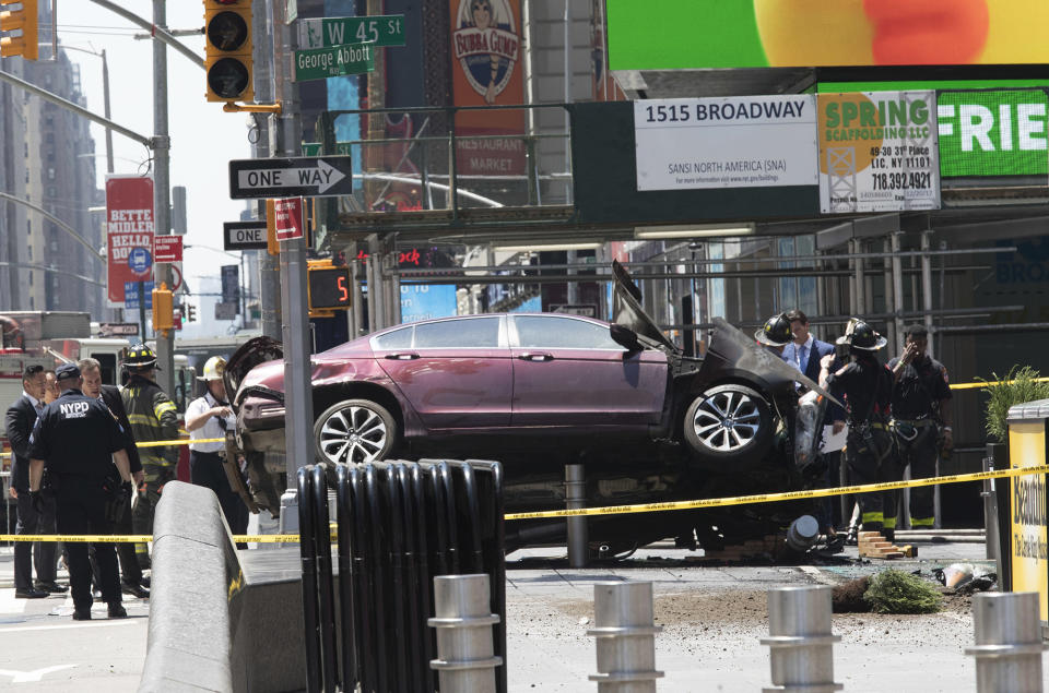 <p>A car rests on a security barrier in New York’s Times Square after driving through a crowd of pedestrians, injuring at least a dozen people, Thursday, May 18, 2017. (AP Photo/Mary Altaffer) </p>