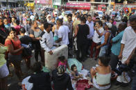 <p>Displaced occupants of a collapsed building sit and gather on the sidewalk in Sao Paulo, Brazil, Tuesday, May 1, 2018. (Photo: Andre Penner/AP) </p>