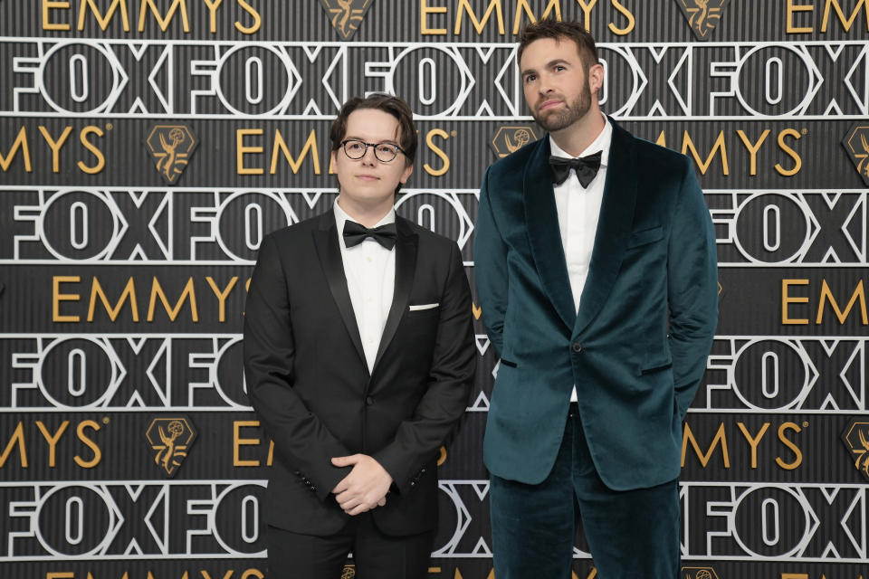 Mekki Leeper, left, and Ronald Gladden arrive at the 75th Primetime Emmy Awards on Monday, Jan. 15, 2024, at the Peacock Theater in Los Angeles. (AP Photo/Ashley Landis)