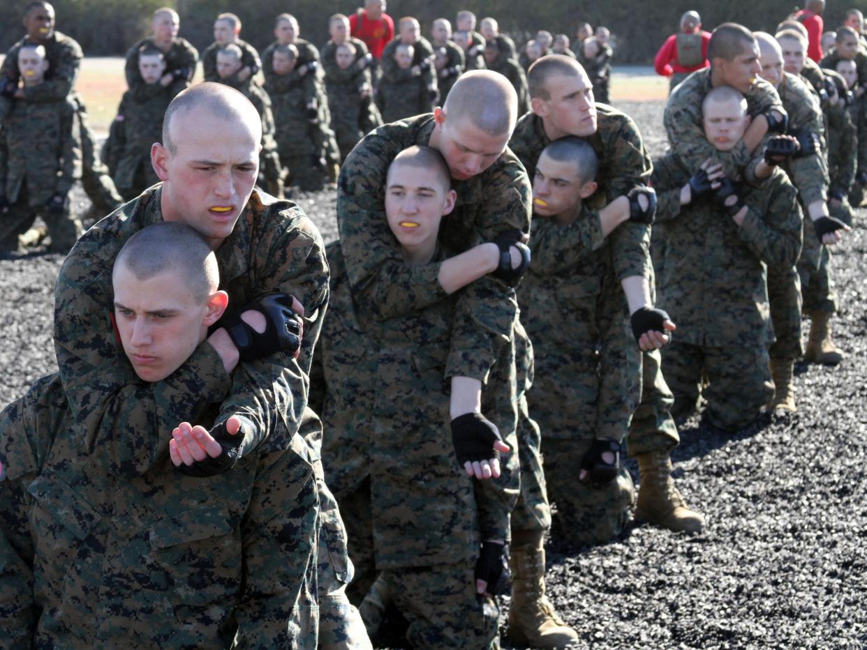 Marine Corps recruits practice applying chokeholds during martial arts training at the Marines Corps Recruit Depot San Diego, California.