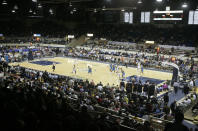 FILE - In this photo taken on Wednesday, Oct. 8, 2008, the Indiana Pacers bring the ball upcourt as they play the New Orleans Hornets in the first quarter of a preseason NBA basketball game in Indianapolis. The game was played the in original home of the Pacers, the Coliseum at the Indiana State Fair Grounds. The Coliseum is one of six venues hosting NCAA Tournament games later this week. (AP Photo/Michael Conroy, File)