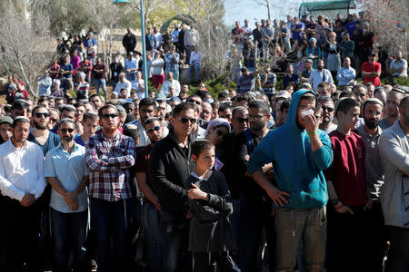 Relatives and friends mourn during the funeral of Israeli rabbi Achiad Ettinger, in the Jewish settlement of Eli in the Israeli-occupied West Bank March 18, 2019. REUTERS/Ronen Zvulun