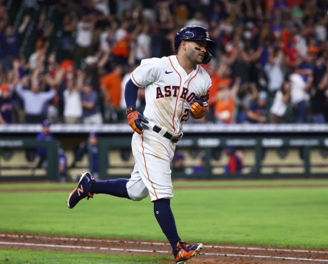 Altuve hits grand slam in 10th, Astros rally past Rangers