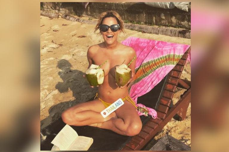 Caroline Flack shows off her 'lovely coconuts' as she strips off on holiday