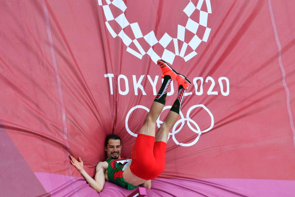 <p>Mexico's Edgar Rivera competes in the men's high jump qualification during the Tokyo 2020 Olympic Games at the Olympic Stadium in Tokyo on July 30, 2021. (Photo by Antonin THUILLIER / AFP)</p> 