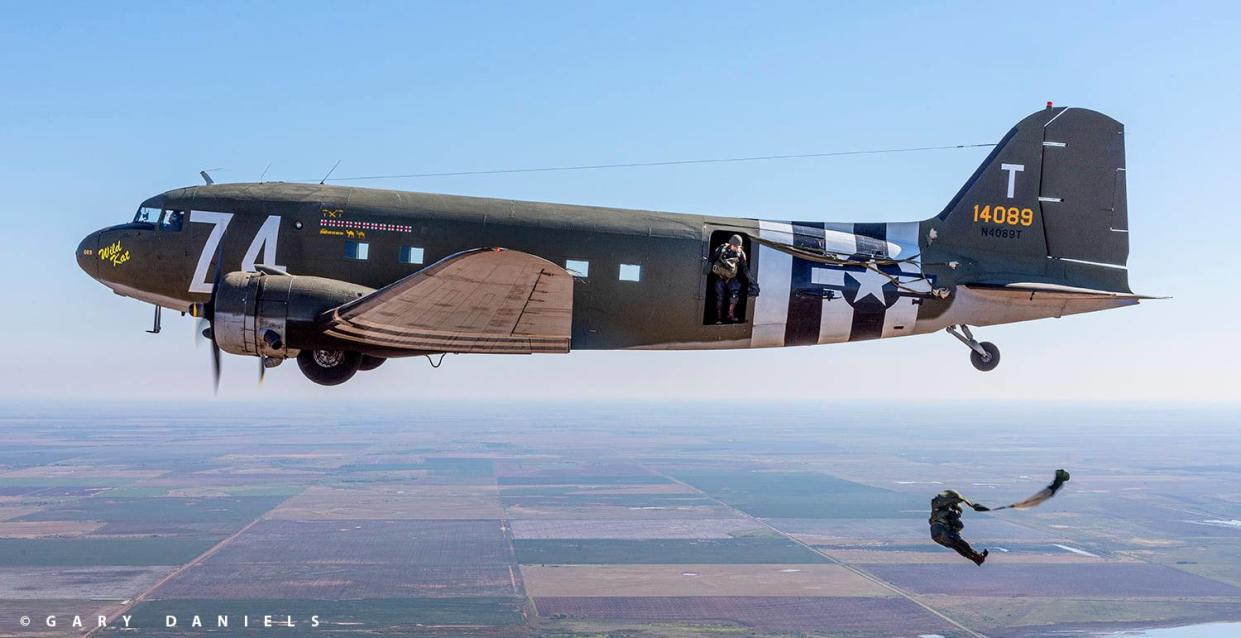 Parachuters jump from the Wild Kat, a 1941 Douglas DC-3. The WWII Airborne Demonstration Team recently moved the plane to the Bartlesville Municipal Airport.