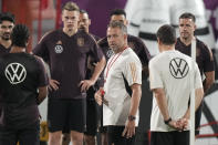 Germany's head coach Hansi Flick instructs his team during a training session at the Al-Shamal stadium on the eve of the group E World Cup soccer match between Germany and Costa Rica, in Al-Ruwais, Qatar, Tuesday, Nov. 29, 2022. Germany will play the third match against Costa Rica on Thursday, Dec. 1. (AP Photo/Matthias Schrader)