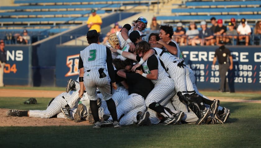 FULLERTON, CA - JUNE 19, 2021: Thousand Oaks celebrates their 3-2 win over Trabuco Hills in the CIF Southern Section Division 2 Championship at Cal State Fullerton on June 19, 2021 in Fullerton, California.(Gina Ferazzi / Los Angeles Times)