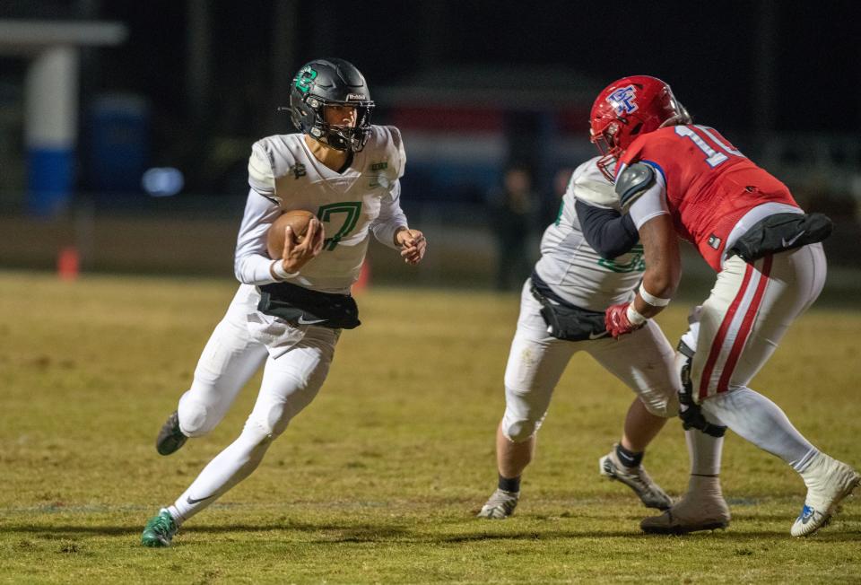 Chocktaw quarter back Jesse Winslette runs down field during the FHSAA State Championship playoff game at Pine Forest High School Friday, November 18, 2022. Chocktaw went on to defeat Pine Forest 30-29.