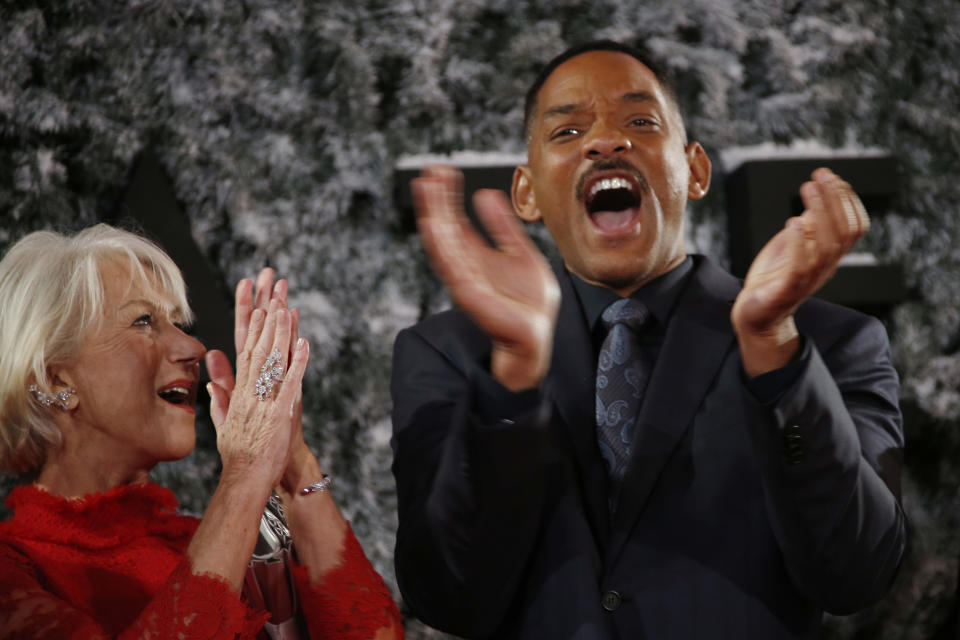 Actors Helen Mirren and Will Smith applaud upon arrival at the premiere of the film 'Collateral Beauty' in London, Thursday, Dec. 15, 2016. (Photo by Joel Ryan/Invision/AP)