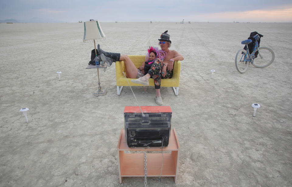 <p>Jody Friedman and Jeff Montgomery infront of the Playa TV as approximately 70,000 people from all over the world gather for the 30th annual Burning Man arts and music festival in the Black Rock Desert of Nevada, U.S. August 30, 2016. (REUTERS/Jim Urquhart) </p>