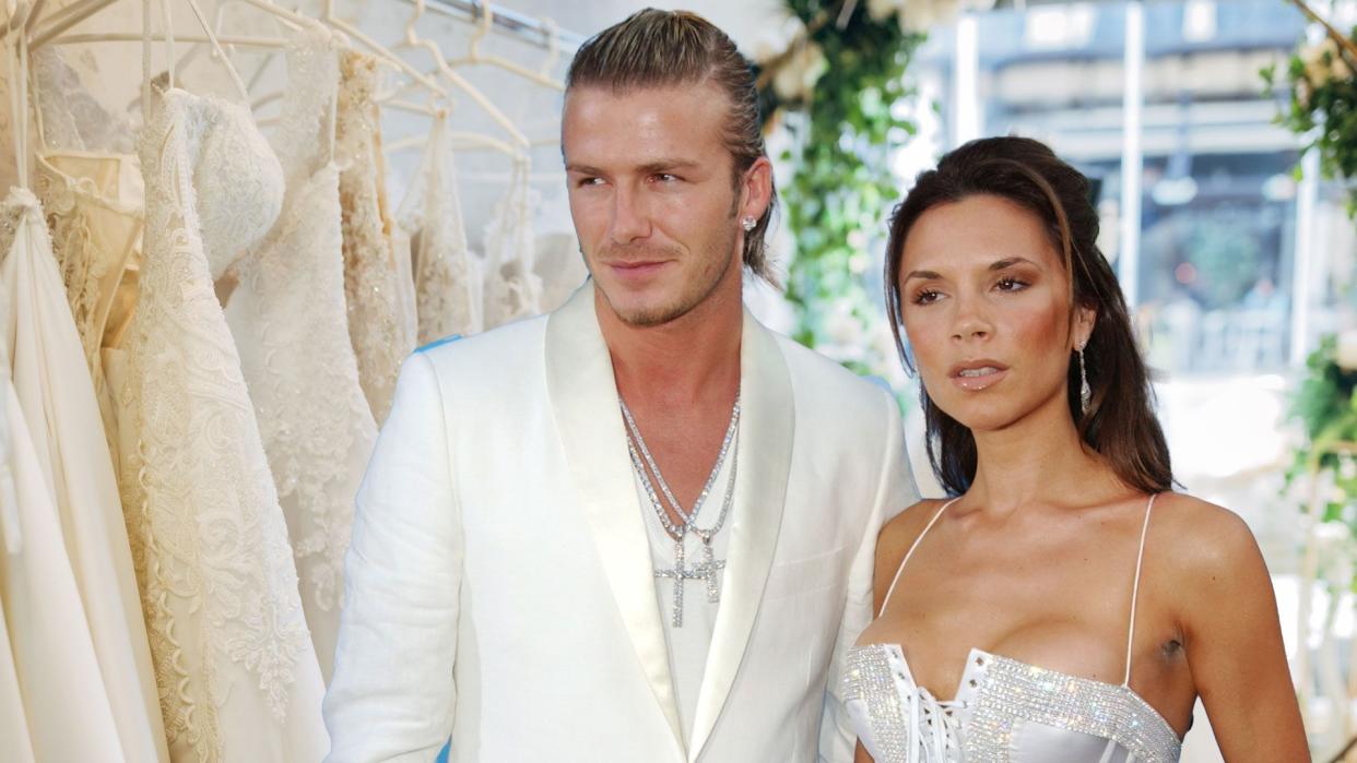 David and Victoria Beckham in 2000s in bridal dress shop