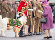 <p>In a purple coat and hat. <i>(Photo by Mark Cuthbert/UK Press via Getty Images)</i></p>