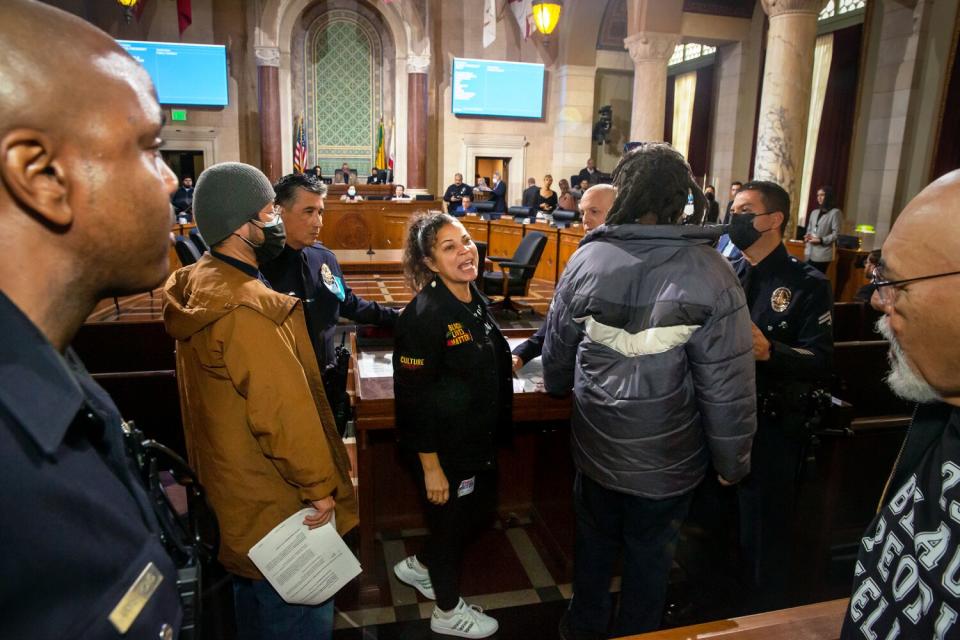 Melina Abdullah protests the deaths of Takar Smith and Keenan Anderson by L.A police at City Hall.