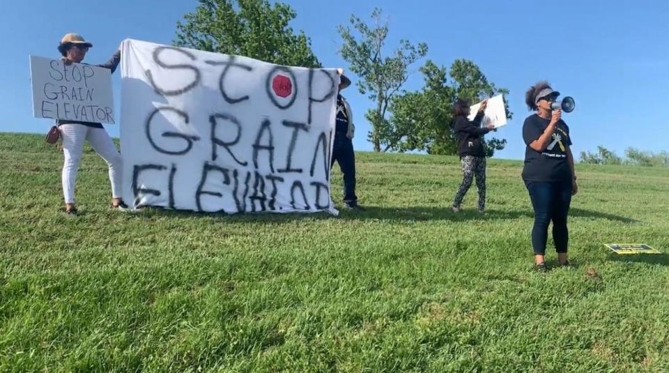PHOTO: Joy Banner protests against the installation of a grain facility in their backyard. (Courtesy of Jo and Joy Banner)