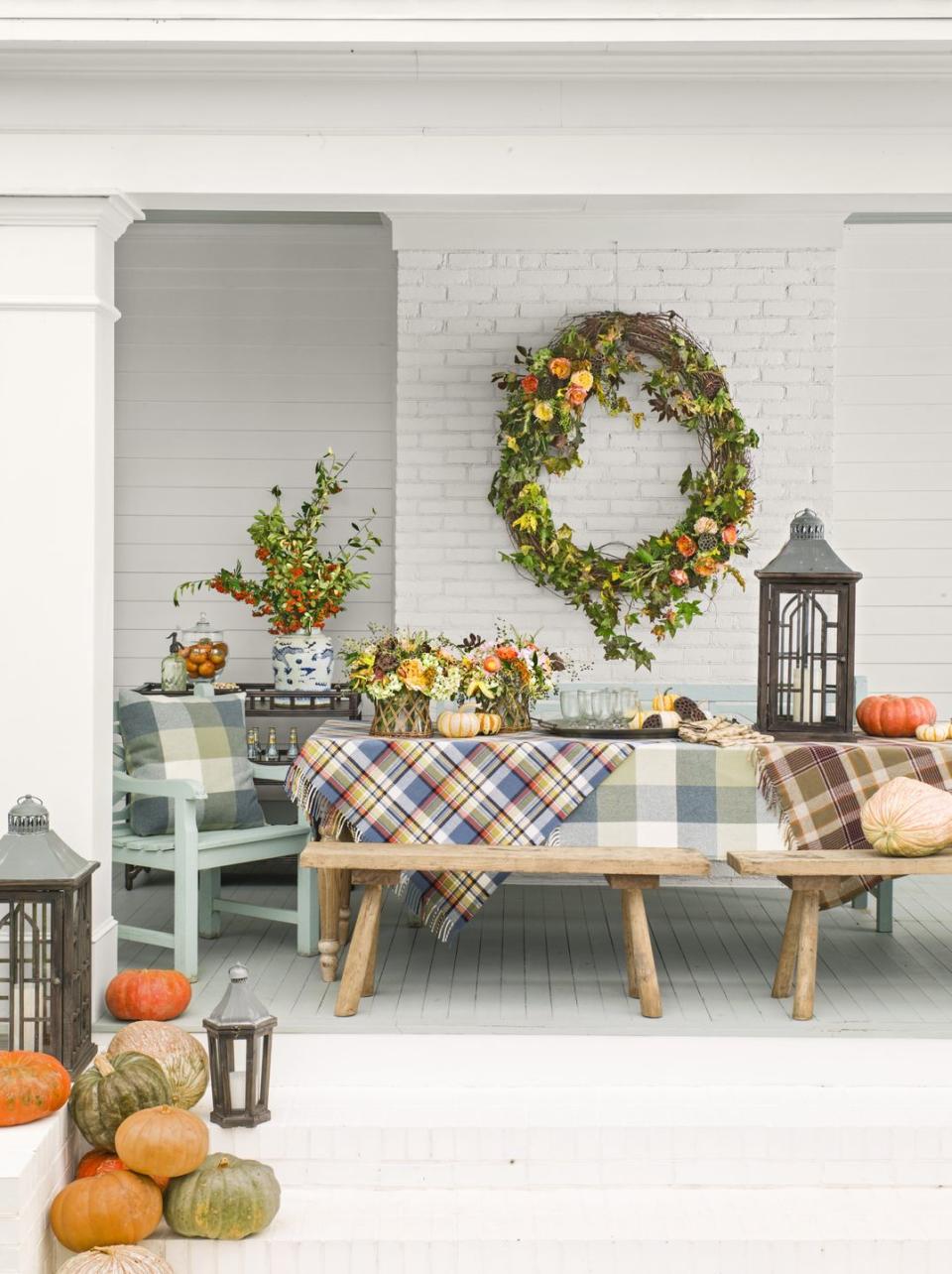 <p>This Halloween set-up is so lovely, we'd leave it up all season! (Actually, that's the whole idea behind the back porch decor you see here.) </p>