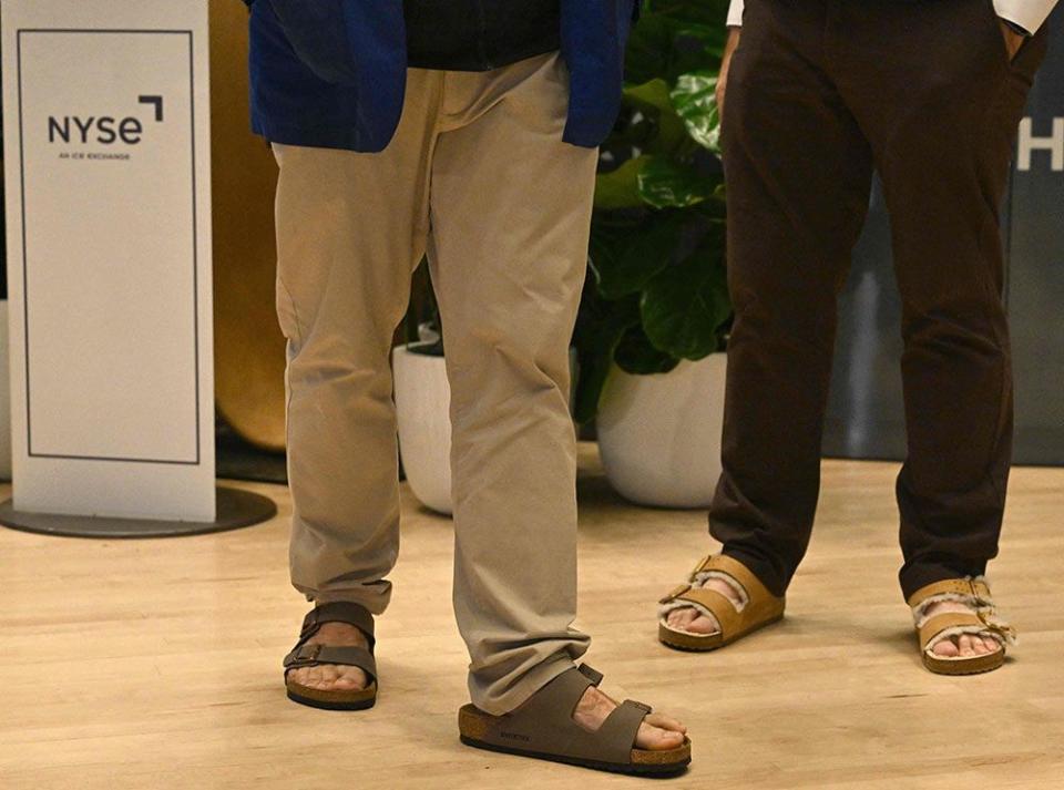  Traders at the New York Stock Exchange wear Birkenstock sandals today, during the sandal-maker’s IPO.