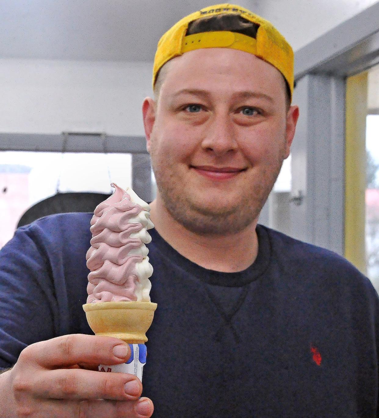 The Golden Bear in Apple Creek Manager Tony Buss with a black raspberry vanilla twist cone. Their homemade hand-scoop ice cream will be on sale sometime in April.