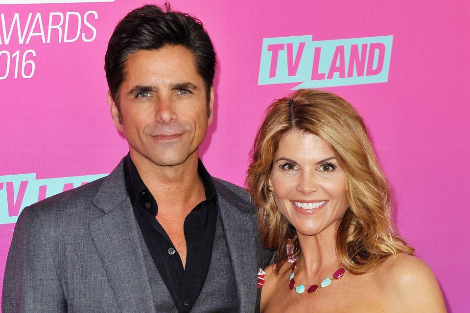 John Stamos and Lori Loughlin arrive at the TV Land Icon Awards at The Barker Hanger on April 10, 2016 in Santa Monica, California.