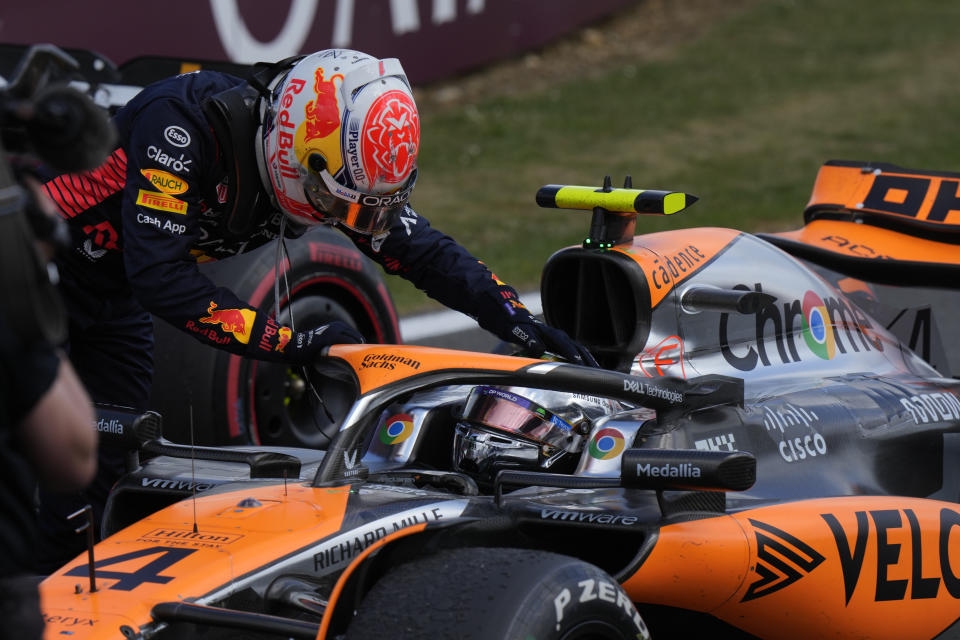 Red Bull driver Max Verstappen of the Netherlands congratulates second placed McLaren driver Lando Norris of Britain after winning the British Formula One Grand Prix race at the Silverstone racetrack, Silverstone, England, Sunday, July 9, 2023. (AP Photo/Luca Bruno)