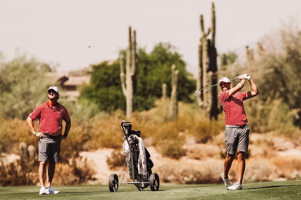 Texas Tech golf coach Greg Sands, left, watches a tee shot from Ludvig Aberg, right, during the Red Raiders' NCAA match-play quarterfinal Tuesday against Vanderbilt. Aberg won his match, but the Commodores beat the Red Raiders 3-2.