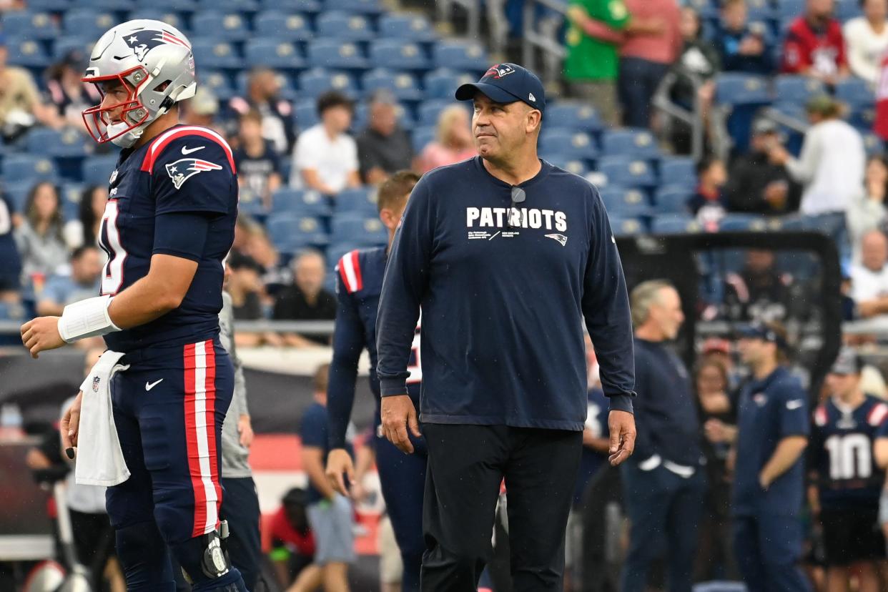 Aug 10, 2023; Foxborough, Massachusetts, USA; New England Patriots offensive coordinator/quarterbacks coach Bill O'Brien watches over quarterback Mac Jones (10) and the offense during the warm up period before a game against the Houston Texans at Gillette Stadium. Mandatory Credit: Eric Canha-USA TODAY Sports