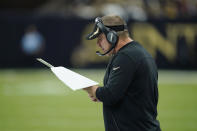 New Orleans Saints head coach Sean Payton reads his chart in the first half of an NFL football game against the Buffalo Bills in New Orleans, Thursday, Nov. 25, 2021. (AP Photo/Derick Hingle)