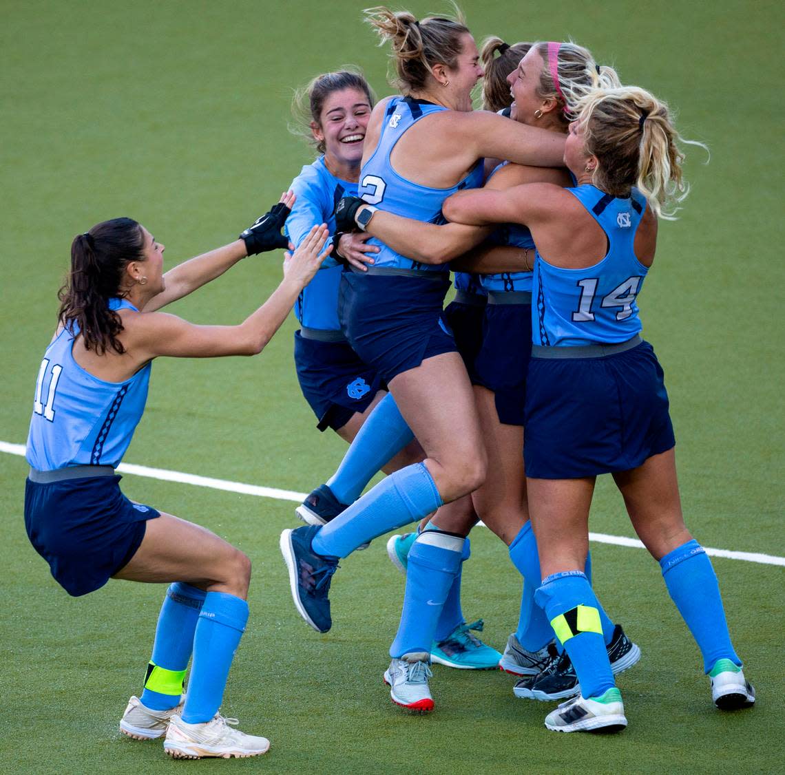 North Carolina’s Charly Bruner (2) embraces Ryleigh Heck (12) after she scored the game winning goal in a sudden death shootout on Northwestern goalie Annabel Skubisz to clinch the NCAA Division I Field Hockey Championship on Sunday, November 19, 2023 at Karen Shelton Stadium in Chapel Hill, N.C.