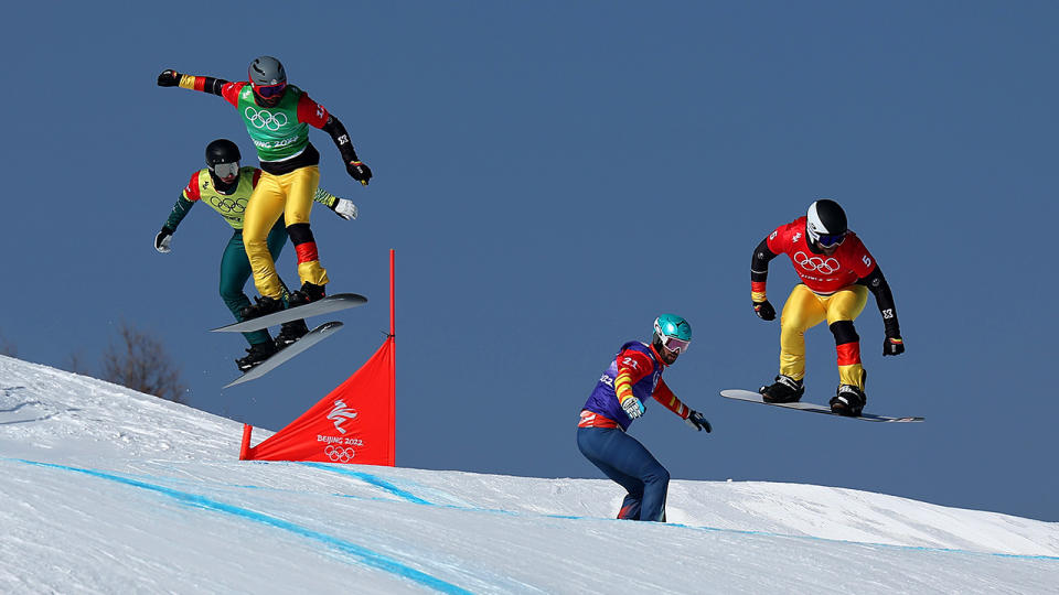 Jarryd Hughes crashed out of the 1/8 heat of the men's snowboard cross at the Beijing Winter Olympics. (Photo by Lars Baron/Getty Images)