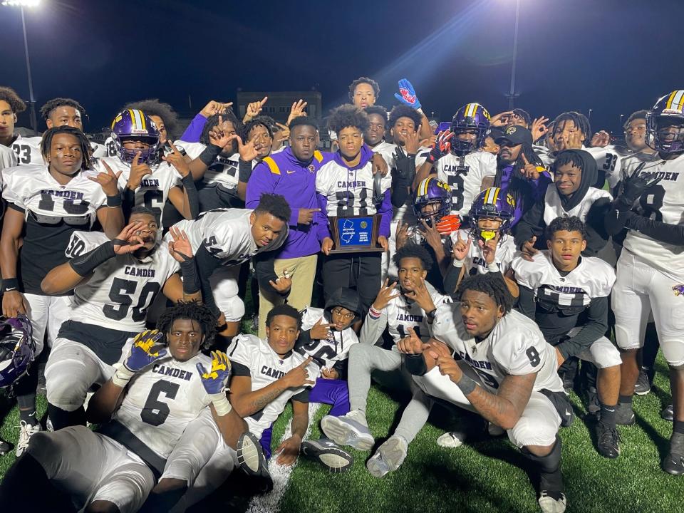 The Camden High football team celebrates after defeating Seneca 21-0 in the Central Jersey Group 3 final on Saturday.