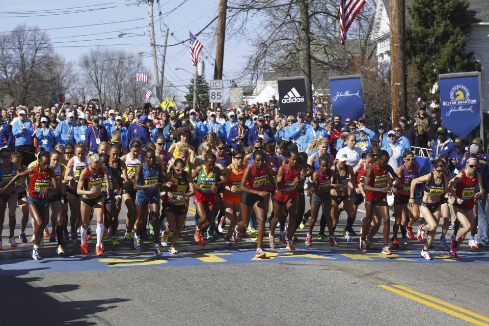 Athletes from the elite women field start during the 118th running of the Boston Marathon in Hopkinton, Massachusetts, April 21, 2014. Some 36,000 athletes will run in the 118th Boston Marathon on Monday in the first running of the race since last year's bombing attack, with top ranked Kenyan and Ethiopian runners among the second-largest field in the race's history. REUTERS/Dominick Reuter (UNITED STATES - Tags: SPORT ATHLETICS)