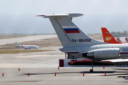 An airplane with the Russian flag is seen at Simon Bolivar International Airport in Caracas, Venezuela March 24, 2019. REUTERS/Carlos Jasso