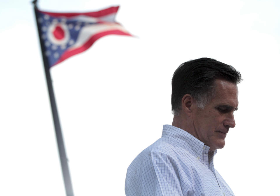 The Ohio state flag flies in the background while Republican presidential candidate, former Massachusetts Gov. Mitt Romney speaks during a campaign event at the Ross County Court House, Tuesday, Aug. 14, 2012 in Chillicothe, Ohio. (AP Photo/Mary Altaffer)