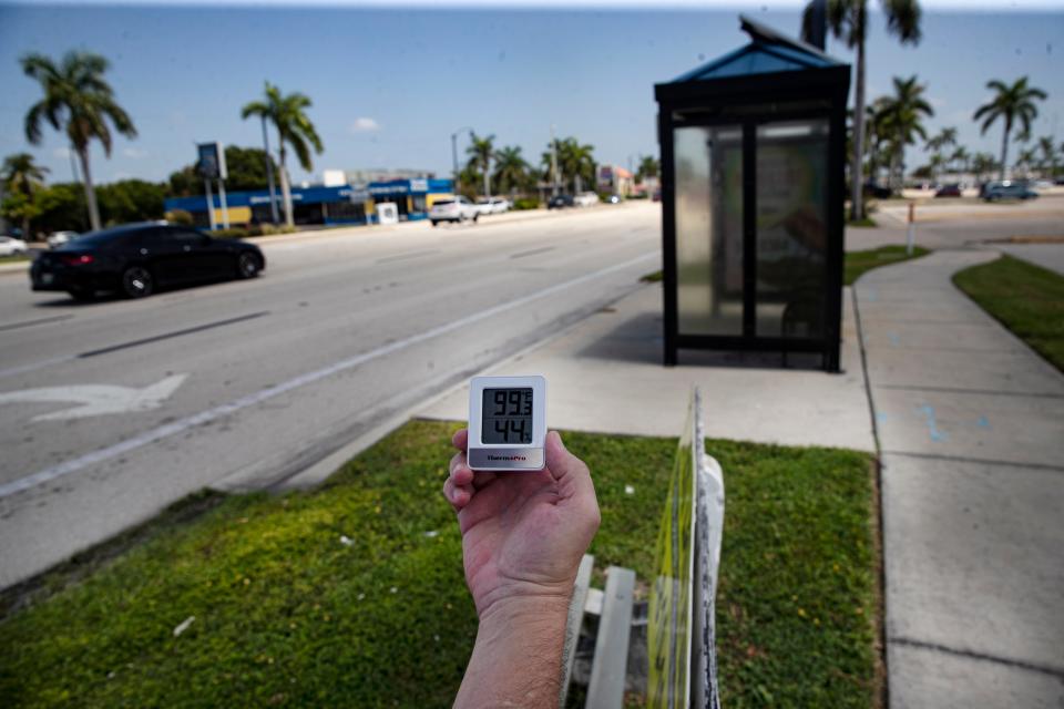 News-Press reporter Chad Gillis displays a thermometer on U.S.41 in front of Edison Mall in Fort Myers on Thursday, July, 28, 2022.