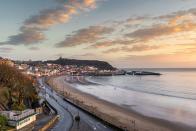 <p>Two wide, sandy bays divided by a rocky promontory topped with 11th-Century ruins of Scarborough Castle make this a scenic seaside escape. You can take a boat trip along the coast from the harbour, have a go surfing and don’t miss a stroll along the promenade for ice creams and award-winning fish and chips at <a href="https://papasfishandchips.com" rel="nofollow noopener" target="_blank" data-ylk="slk:Papas;elm:context_link;itc:0;sec:content-canvas" class="link ">Papas</a>.</p><p><a class="link " href="https://www.booking.com/index.en-gb.html?label=gen173nr-1BCAEoggI46AdIM1gEaFCIAQGYAQm4AQfIAQzYAQHoAQGIAgGoAgO4AoaD8PkFwAIB0gIkMjllNzUwZjMtNzJjNi00ZmQxLTlmZTYtNjljZDNkZGUzNGZm2AIF4AIB%3Bsid%3Dd557a040829a867b722f4b6cf8934591%3Bkeep_landing%3D1&sb_price_type=total" rel="nofollow noopener" target="_blank" data-ylk="slk:FIND ACCOMODATION;elm:context_link;itc:0;sec:content-canvas">FIND ACCOMODATION</a></p>