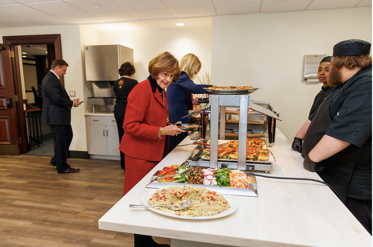 Sen. Gayle Harrell of Stuart and others make their plates at the Holiday Foodie Fete catered by Lively Technical College Dec. 12 in the Senate Dining Room.
(Credit: Supplied photo)